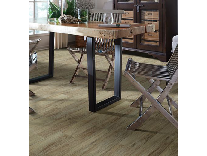 wooden dining table with chairs on luxury vinyl floor