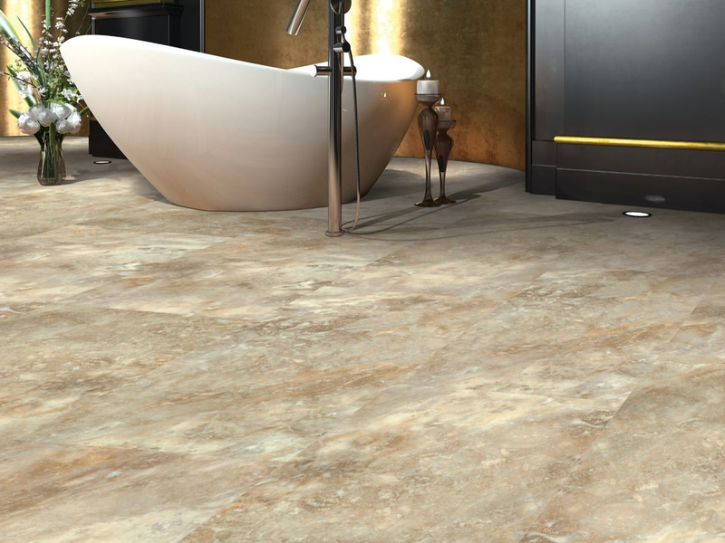 Large stone-look Mohawk luxury vinyl tiles in cream and brown marbling compliment chic bathroom design.